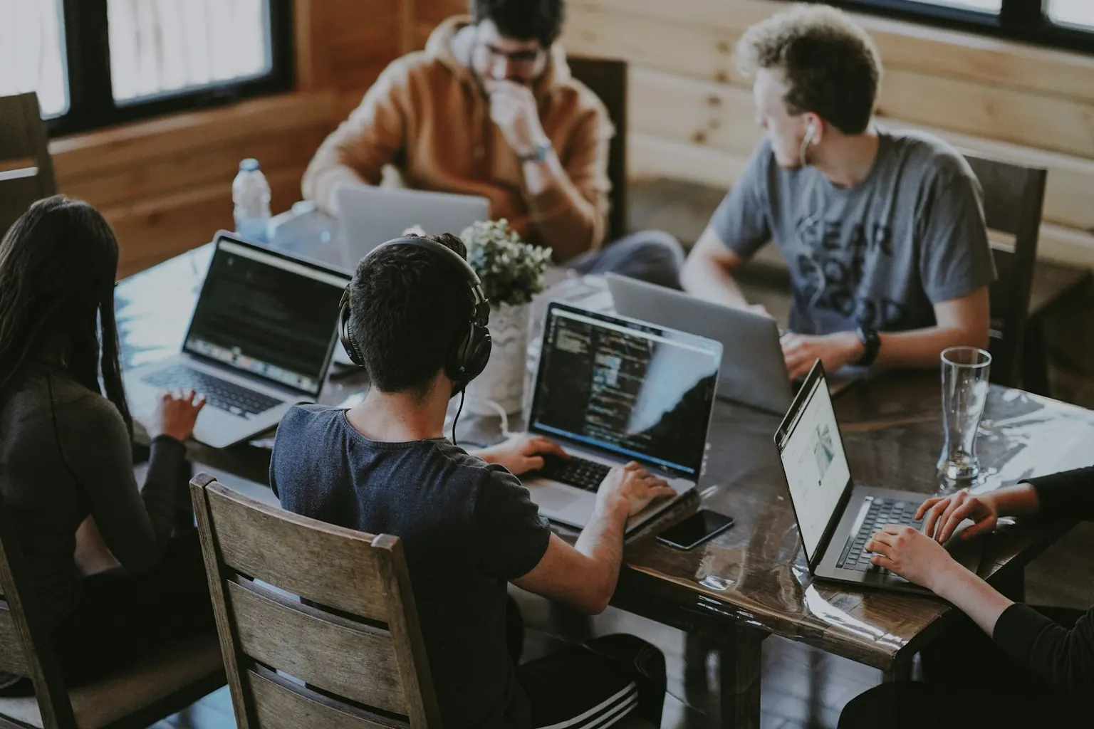 Team working together across laptops in an office