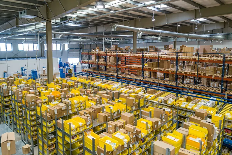 Warehouse aisles stacked with palletised stock