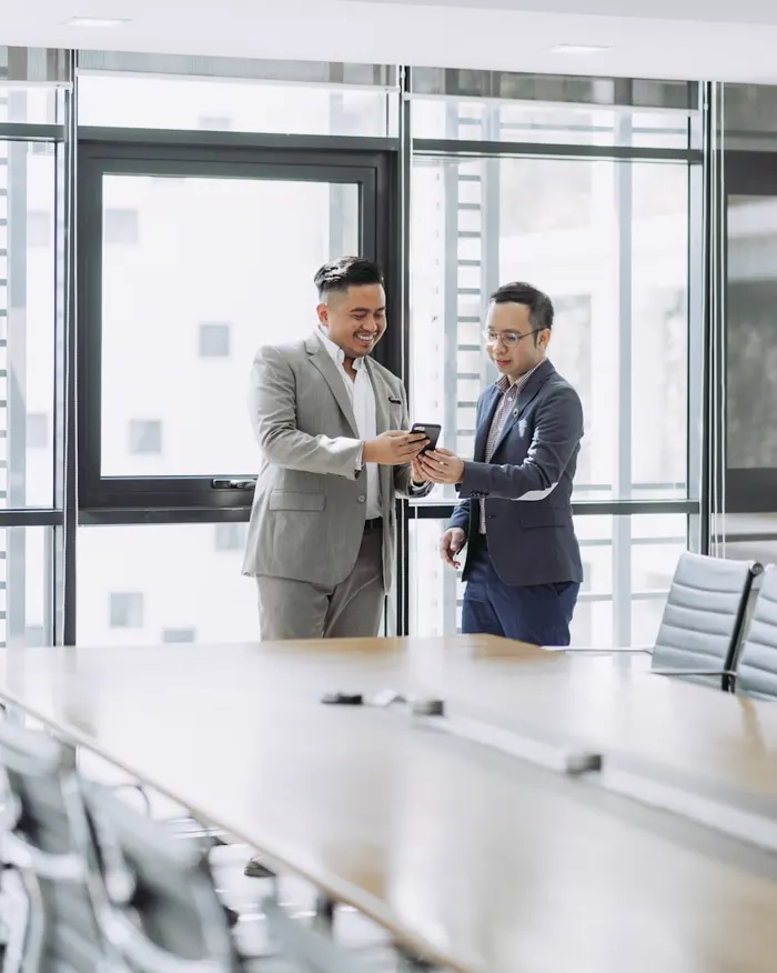 Two team members reviewing work together